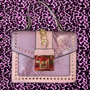 Pink snakeskin print medium sized rectangular shaped purse with detachable strap